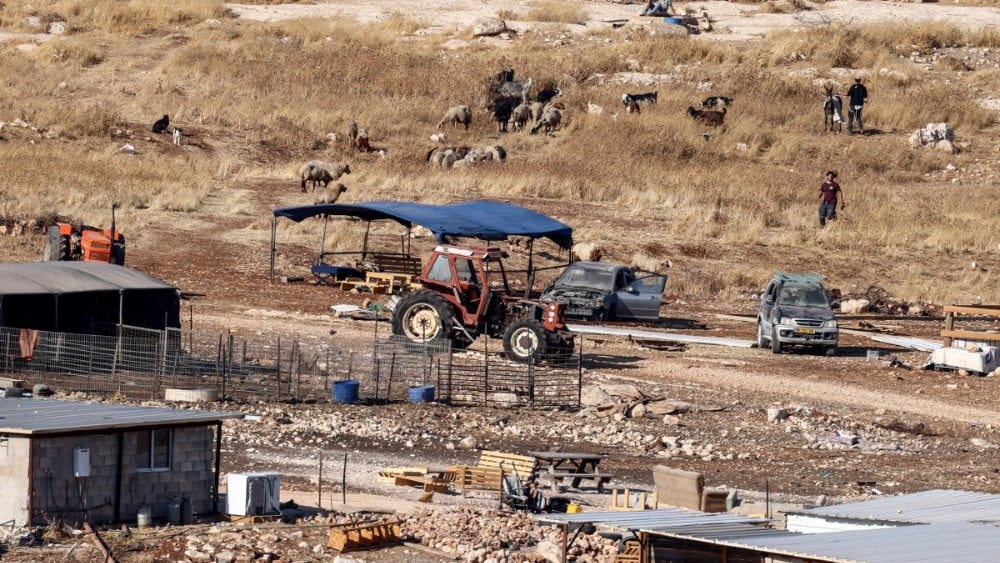 Israeli settlers are seen at a new Israeli settlement outpost near the Kaabneh Bedouin community, east of the Palestinian town of Taybeh, northeast of the city of Ramallah, in the Israeli-occupied West Bank, on August 10, 2026.
