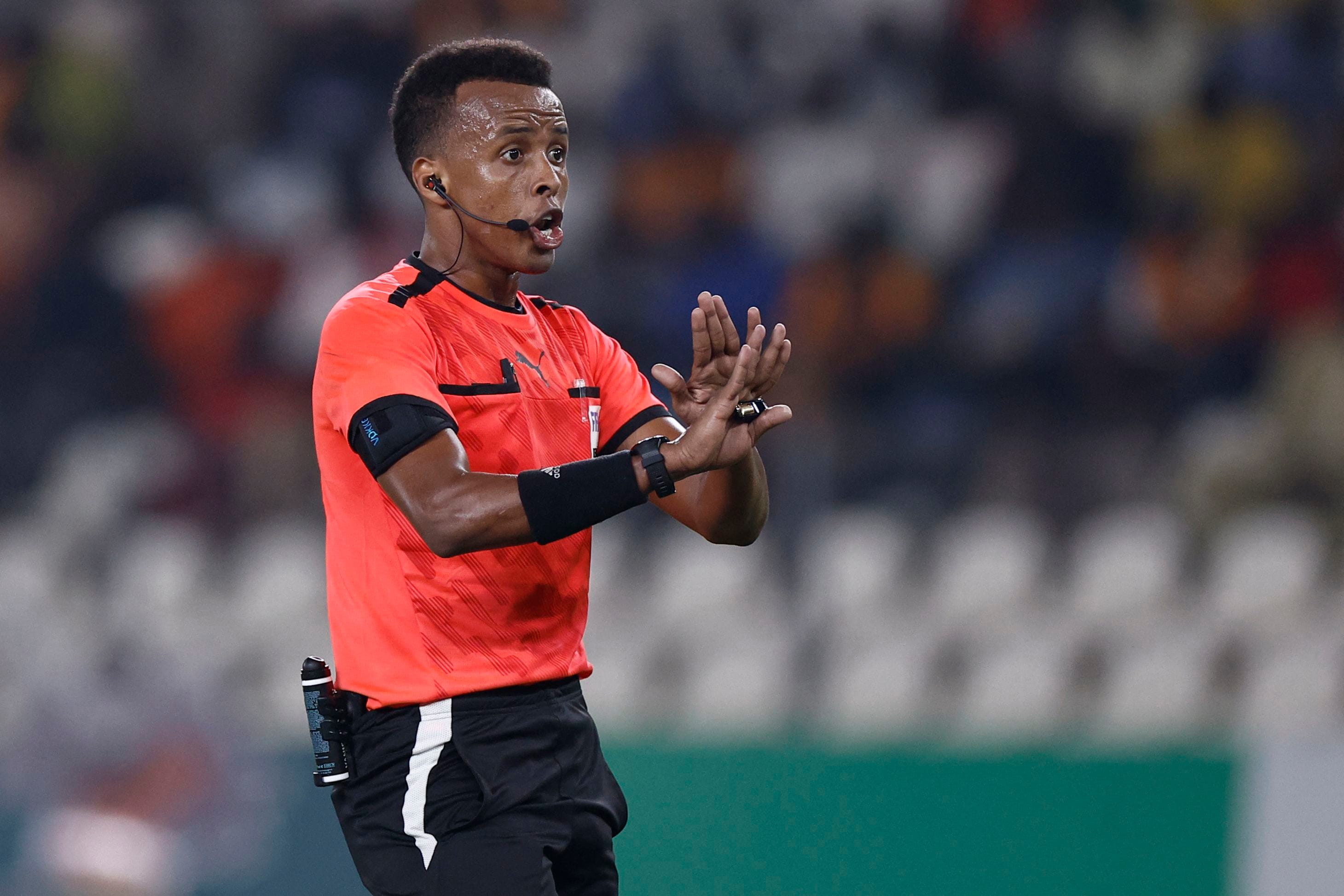 Somalian referee Omar Abdulkadir Artan gestures during the Africa Cup of Nations (CAN) 2024 group D football match between Mauritania and Algeria at Stade de la Paix in Bouake on January 23, 2024. (AFP)