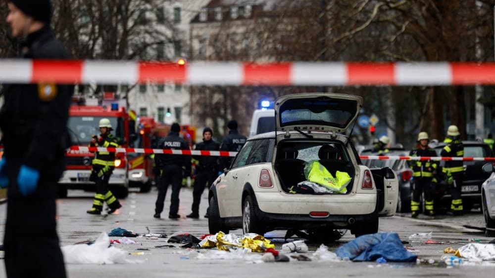 Members of the emergency services work at the scene where a car drove into a crowd in the southern German city of Munich on February 13, 2025, leaving several people injured, police said. (AFP)