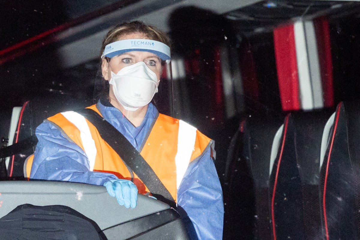 British Nationals, repatriated after a prolonged stay on a cruise ship hit by a deadly hantavirus outbreak, arrive by coach at Arrowe Park Hospital in Wirral, north west England, on May 10, 2026, where they are expected to stay for up to 72 hours.