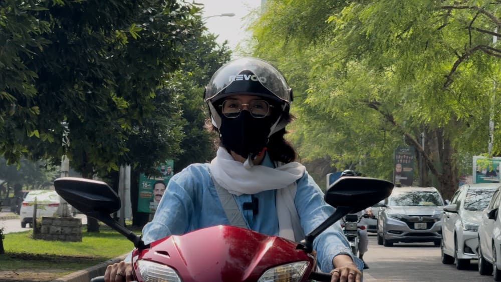 Naushaba bought her petrol scooter four years ago, when her daily commute became too expensive. It now costs her a fraction of what she used to spend on ride-hailing services. (Photo: Video screengrab)