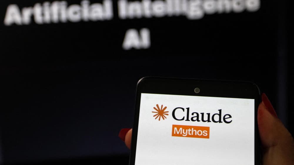 A smartphone displaying the Claude Mythos logo is shown in the foreground with the words Artificial Intelligence AI blurred in the arriere-plan in Tunis,Tunisia on July 11,2026. (AFP)