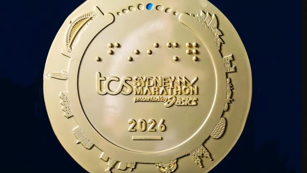 The medal design appears to show Munich's Allianz Arena on the bottom-right (Photo: Instagram/@sydney_marathon)