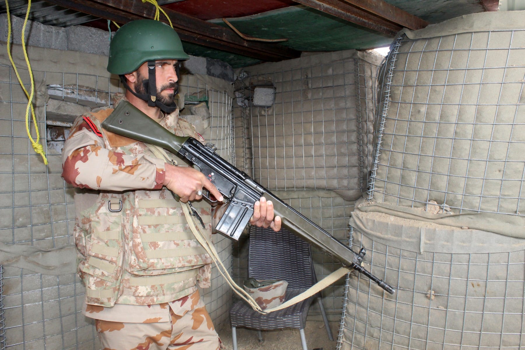 A Pakistani soldier stands guard in a bunker at the Pakistan-Afghanistan border in Chaman on February 27, 2026, following overnight cross-border firing between the two countries. (AFP)