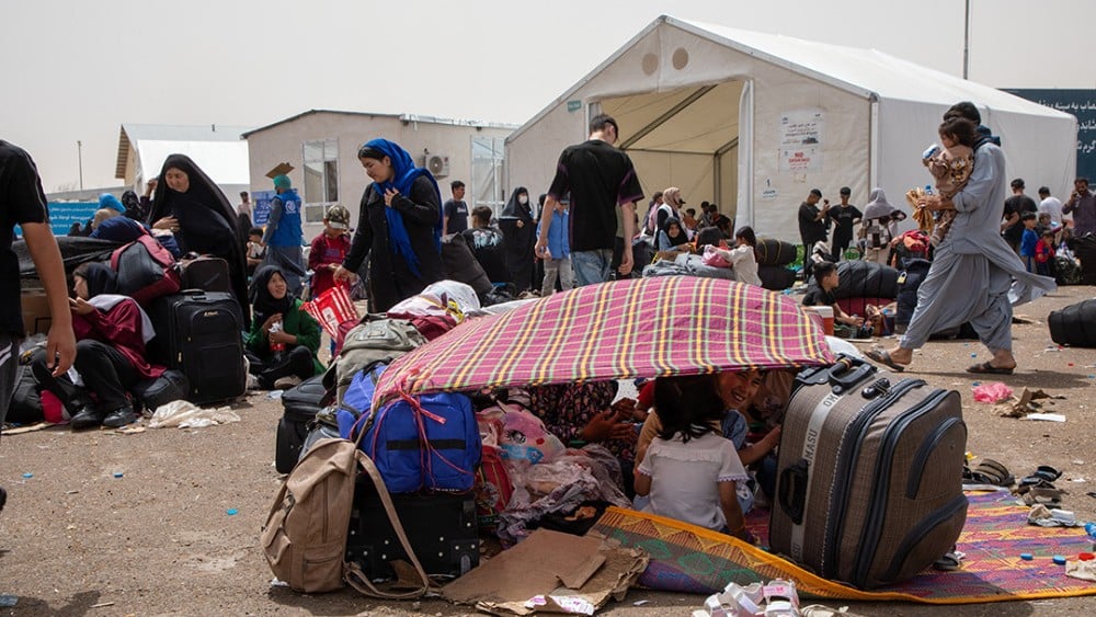 FILE: Afghan families rest under makeshift shelters at the Islam Qala crossing on July 4, 2025. (Photo: Council on Foreign Relations)