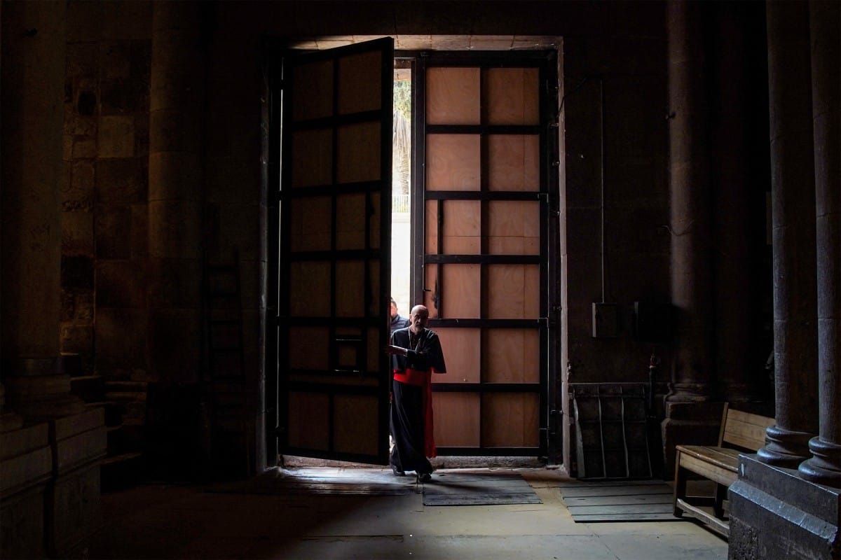 In this handout picture released by the Latin Patriarchate of Jerusalem media office, Cardinal Pizzaballa, Latin Patriarch of Jerusalem, enters the Church of the Holy Sepulchre in the old city of Jerusalem on April 5, 2025 to lead Easter Sunday Mass. (AFP
