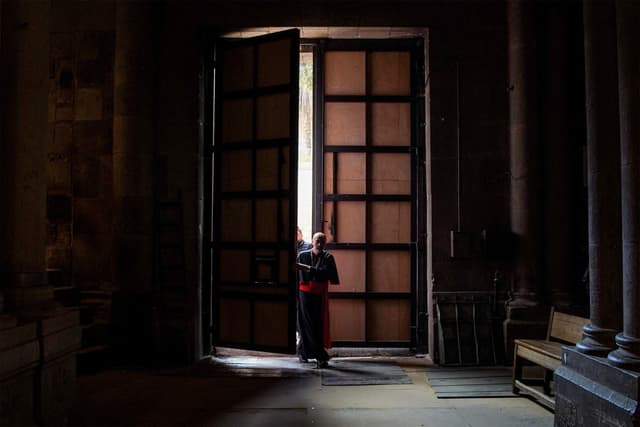 In this handout picture released by the Latin Patriarchate of Jerusalem media office, Cardinal Pizzaballa, Latin Patriarch of Jerusalem, enters the Church of the Holy Sepulchre in the old city of Jerusalem on April 5, 2025 to lead Easter Sunday Mass. (AFP