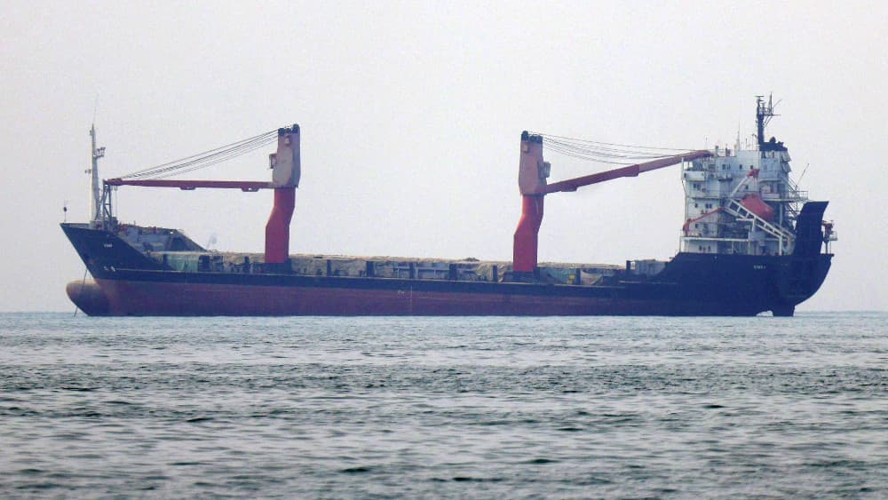A shipping vessel transits the Strait of Hormuz off the coast of Iran's southern port city of Bandar Abbas on September 7, 2026. (AFP)