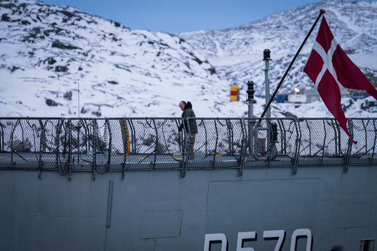 A sailor works on the deck of the HDMS Knud Rasmussen Royal Danish Navy patrol vessel moored at the harbour in Nuuk, Greenland on January 16, 2026 (AFP)