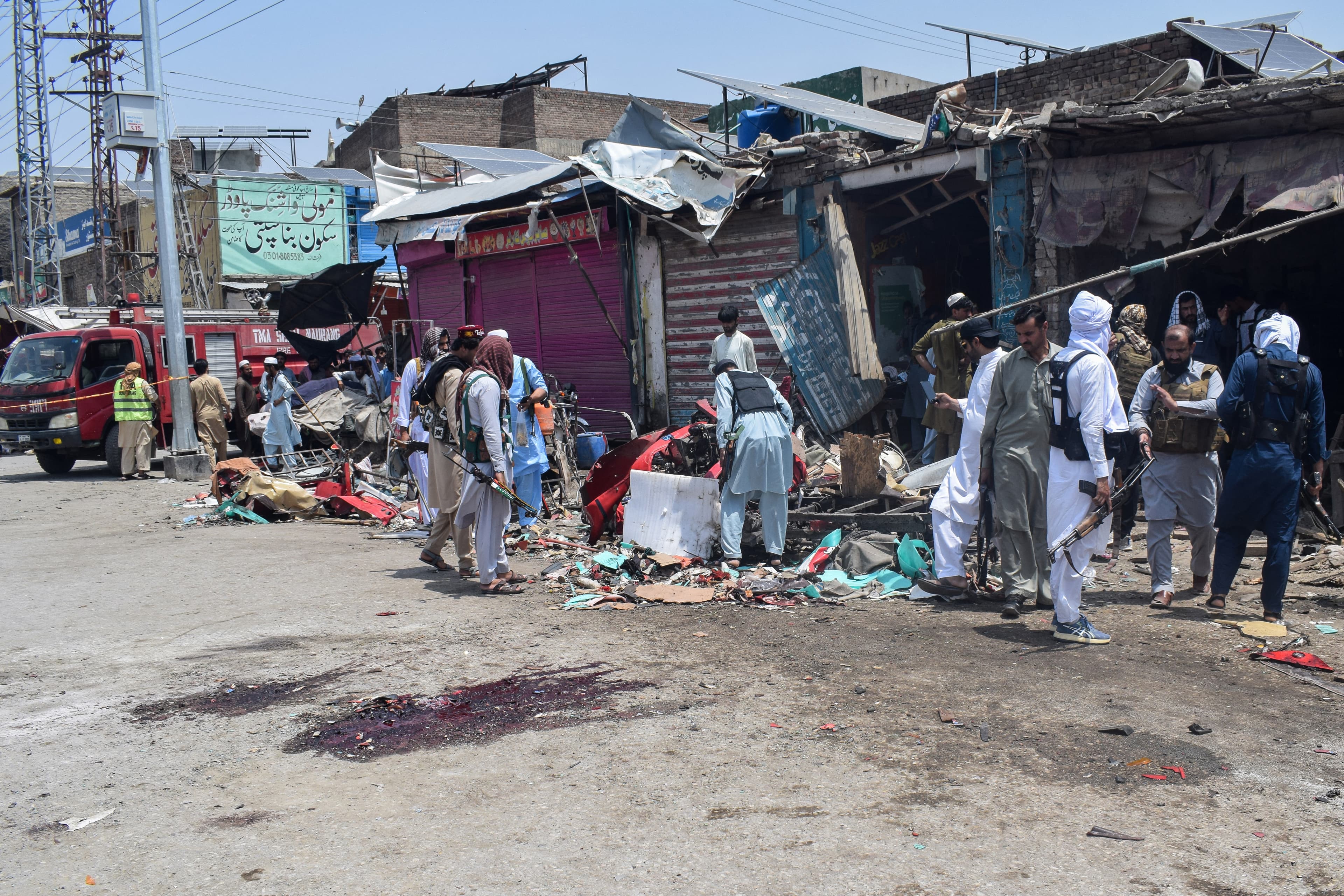 Security personnel inspect the blast site after a suicide attack in the Sarai Naurang area of Pakistan’s Lakki Marwat district on May 12, 2026. (AFP)