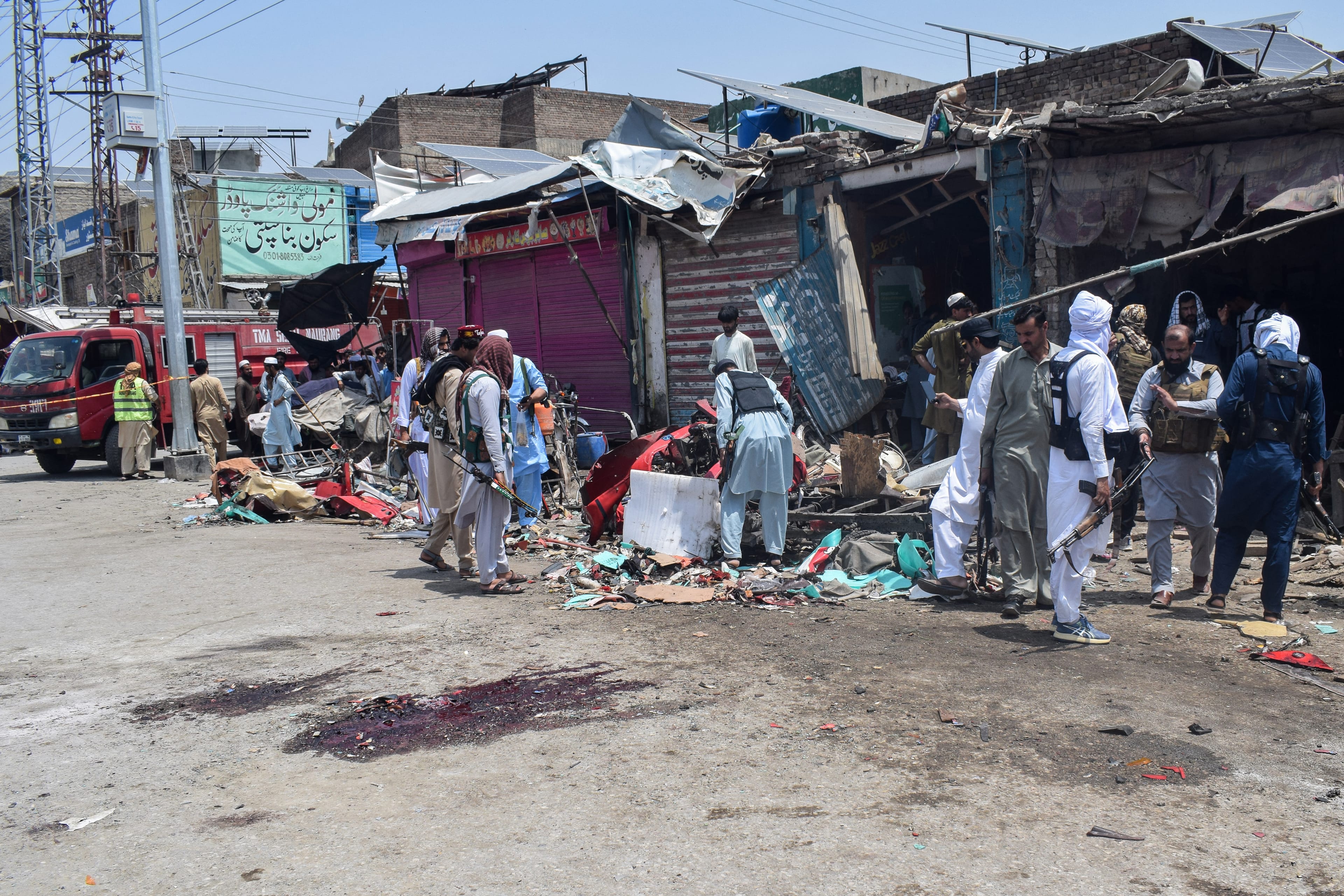 Security personnel inspect the blast site after a suicide attack in the Sarai Naurang area of Pakistan’s Lakki Marwat district on May 12, 2026. (AFP)