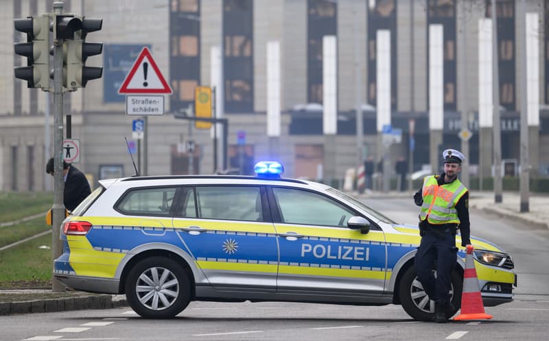 A police officer cordons off Große Meißner Straße during an evacuation of the city center on March 11, 2026. (AFP)