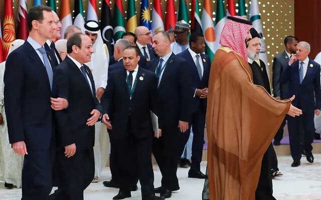 FILE: From left to right: Syria's President Bashar Assad, Lebanon's caretaker Prime Minister Najib Mikati, Egypt's President Abdel-Fattah el-Sissi, as they follow Saudi Crown Prince Mohammed bin Salman (Front R) and Iran's President Ebrahim Raisi (Back R)