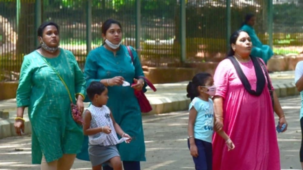Mothers with their kids celebrate weekend at Cubbon park in Bangalore on May 08, 2022. (AFP)