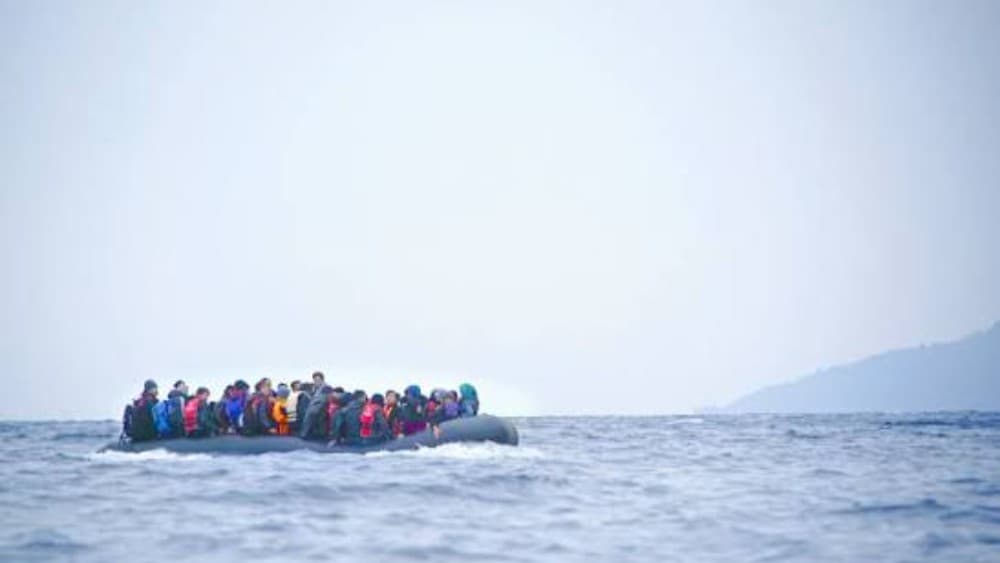 Migrants on a boat (Wikimedia Commons)