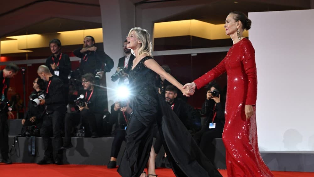 French actress Melanie Laurent (L) and French actress Carole Bouquet attend the red carpet event for the screening of "Un bon avocat" presented out of competition at the 83rd International Venice Film Festival, at Venice Lido on September 11, 2026. (Photo