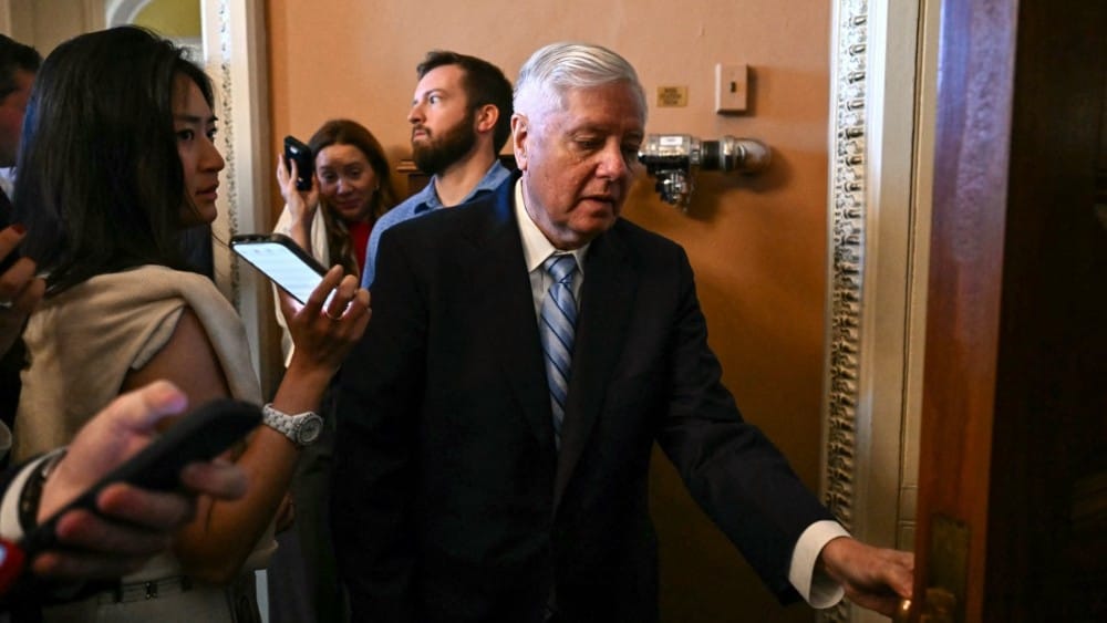 US Senator Lindsey Graham, Republican from South Carolina, is trailed by reporters as he walks to a meeting with Senate Republicans at the US Capitol in Washington, DC, on June 4, 2026.