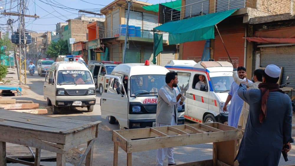 Ambulances are seen at the site of an explosion near the police headquarters in Kohat in Pakistan's Khyber Pakhtunkhwa province on September 18, 2026. (AFP)