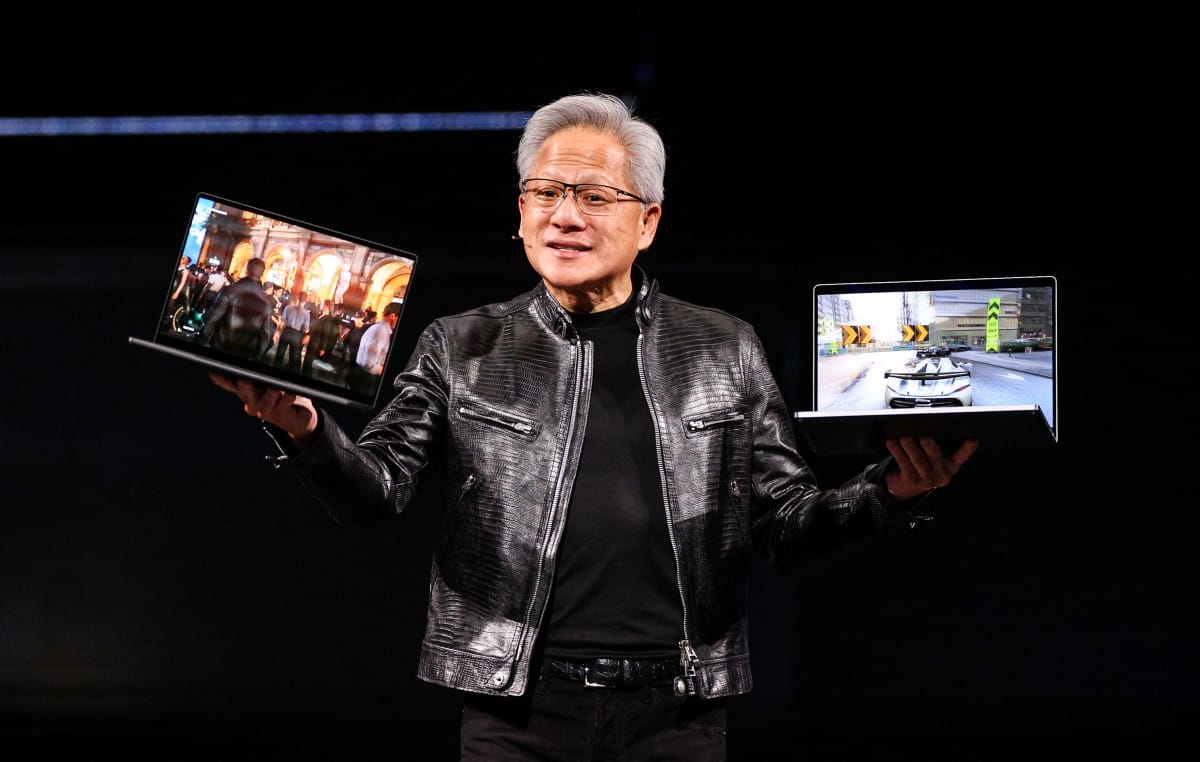 Nvidia CEO Jensen Huang introduces the RTX Spark laptop during his keynote speech at Computex 2026 in Taipei on June 1, 2026. (Photo by I-Hwa Cheng / AFP)