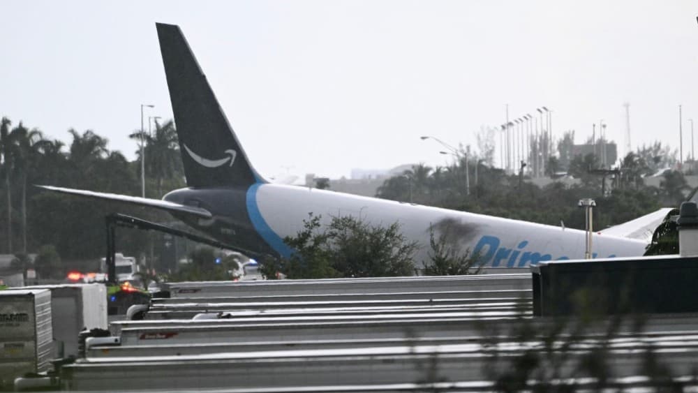 Amazon cargo plane overshoots Miami runway, hits vehicles, catches fire