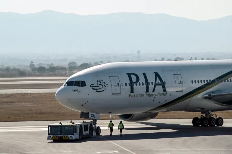A Pakistan International Airlines aircraft taxis before takeoff for France at Islamabad International Airport. (File/AFP)