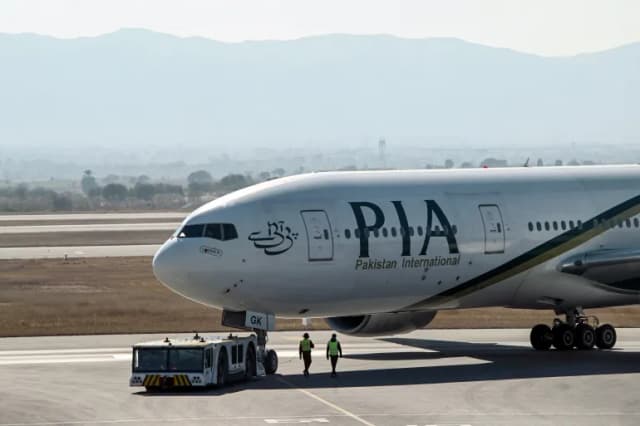 A Pakistan International Airlines aircraft taxis before takeoff for France at Islamabad International Airport. (File/AFP)