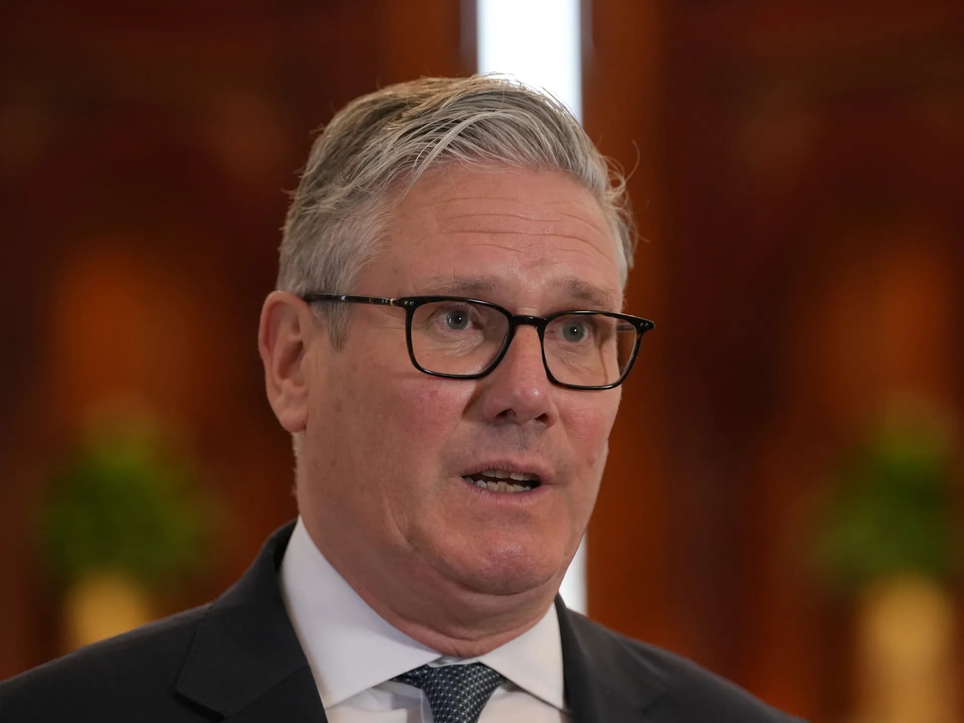 Britain's Prime Minister Keir Starmer speaks to the media at the airport in Doha, Qatar on April 10, 2026. (AFP)