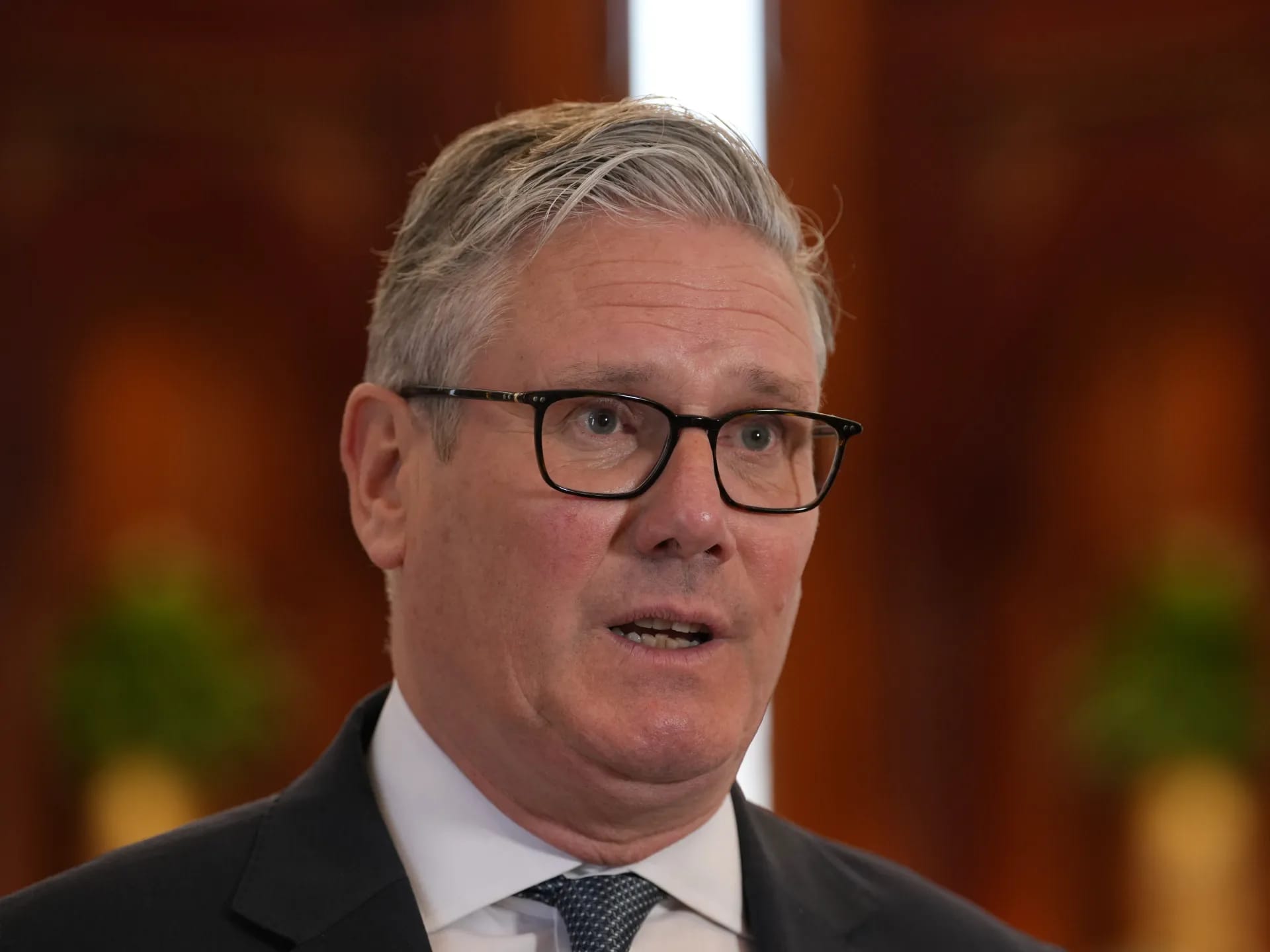 Britain's Prime Minister Keir Starmer speaks to the media at the airport in Doha, Qatar on April 10, 2026. (AFP)
