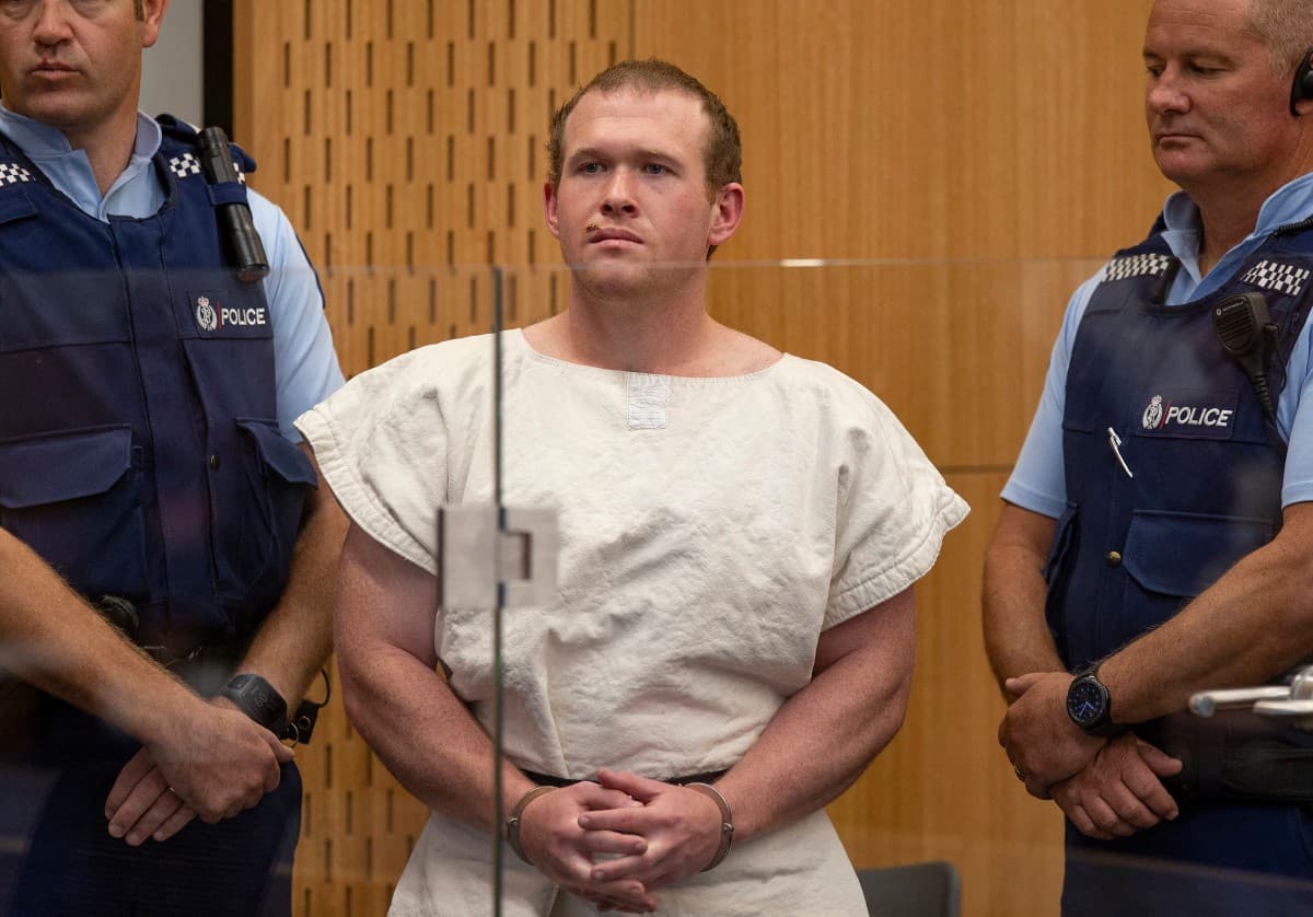 Brenton Tarrant (C), the man charged in relation to the Christchurch massacre, stands in the dock during his appearance at the Christchurch District Court.