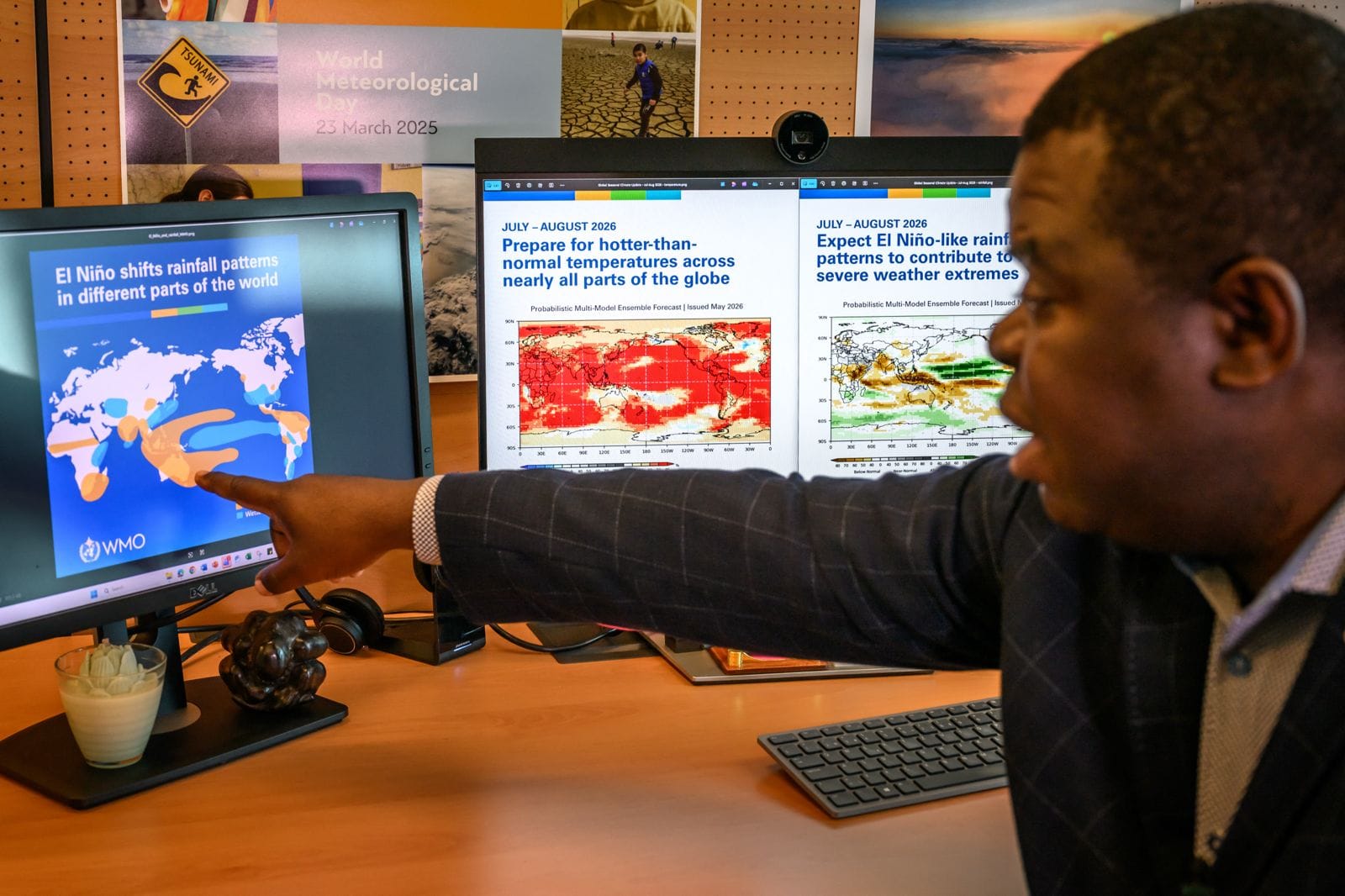 Head of climate prediction services at the World Meteorological Organization (WMO) Wilfran Moufouma-Okia points on graphs displayed on computer screens at the WMO headquarters in Geneva, on June 1, 2026. (AFP)