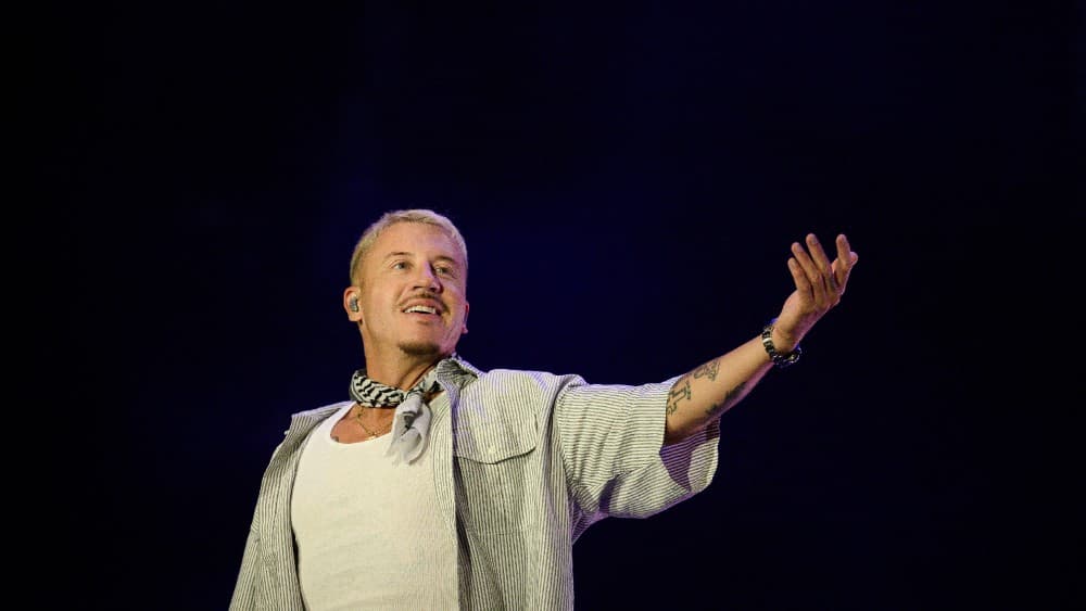 US rapper, singer, dancer and DJ, Benjamin Haggerty, known as Macklemore, performs at the Goldencoast Rap Festival in Corcelles-les-Monts, near Dijon, central-eastern France, on August 30, 2026. (Photo by ARNAUD FINISTRE / AFP)