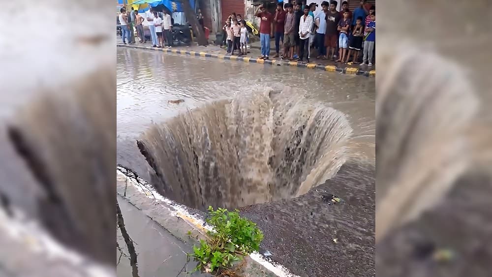 Massive sinkhole appears on busy Indian road after heavy rainfall