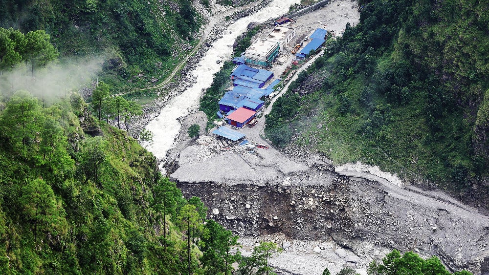 This picture taken on September 2, 2026 shows concrete mixer trucks damaged and half-buried in mud following flash floods at the Upper Trishuli-1 (UT-1) Hydropower Plant construction site in Nepal's Rasuwa district. (AFP)