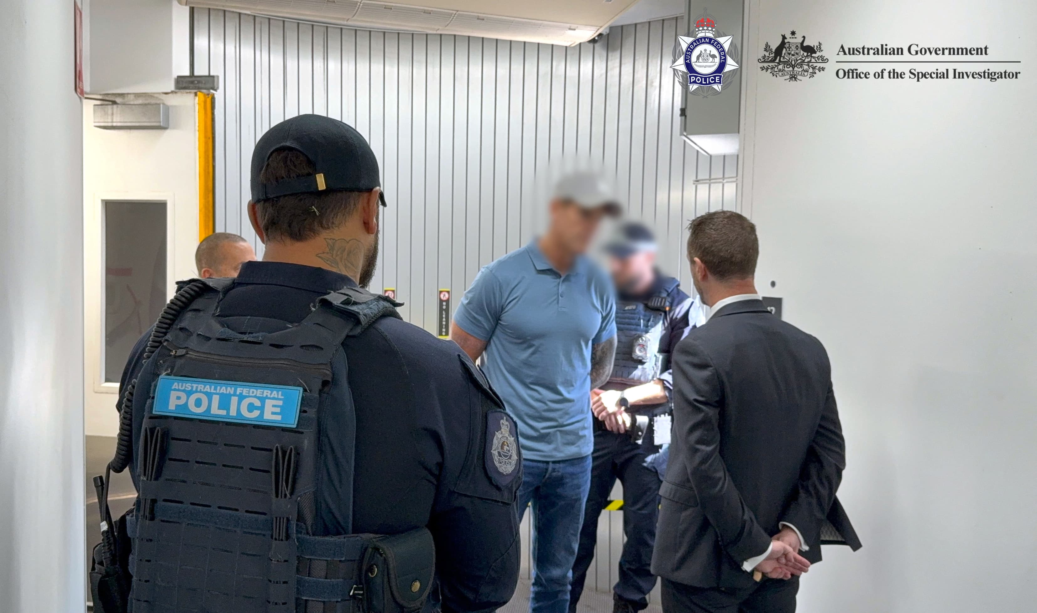 This handout image taken and released on April 7, 2026 by the Australian Federal Police shows police arresting a 47-year-old former Australian soldier, who was widely named in local media as Victoria Cross recipient Ben Roberts-Smith, in Sydney.