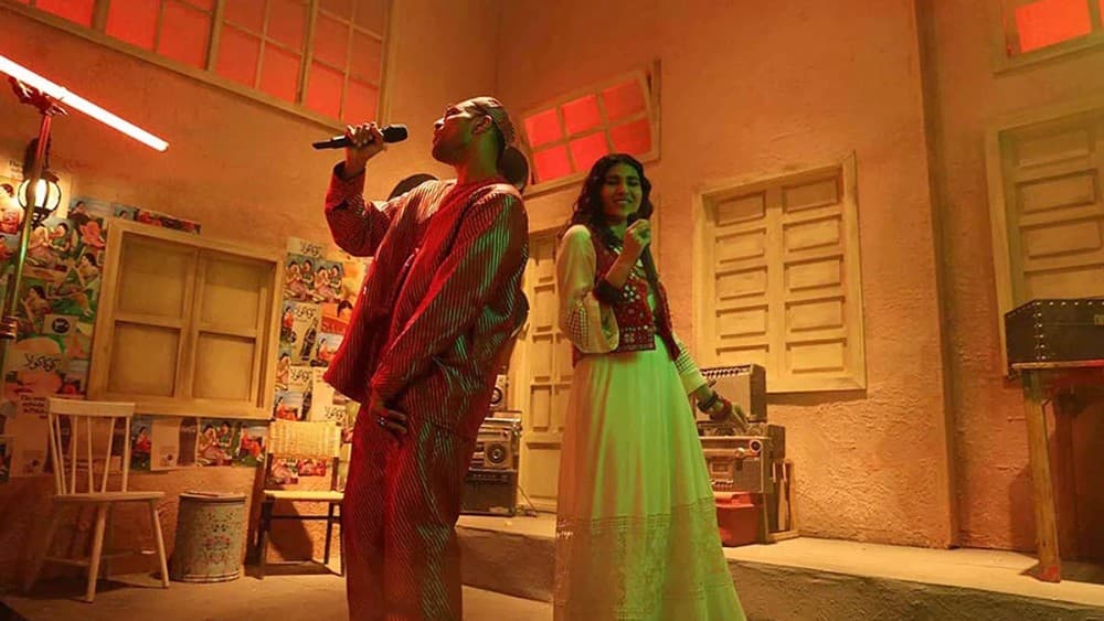 In this handout picture, released by Coke Studio Pakistan on February 7, 2022, Pakistani singers Ali Sethi and Shae Gill gesture during the recording of their popular song 'Pasoori'. (Photo: Coke Studio)