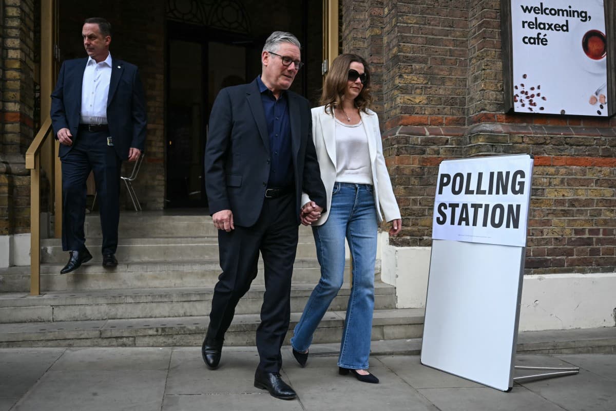 Britain's Prime Minister Keir Starmer (C) and his wife Victoria Starmer (R) leave after casting their votes at a polling station in Westminster Chapel, central London on May 7, 2026, as polls open for local elections. (AFP)