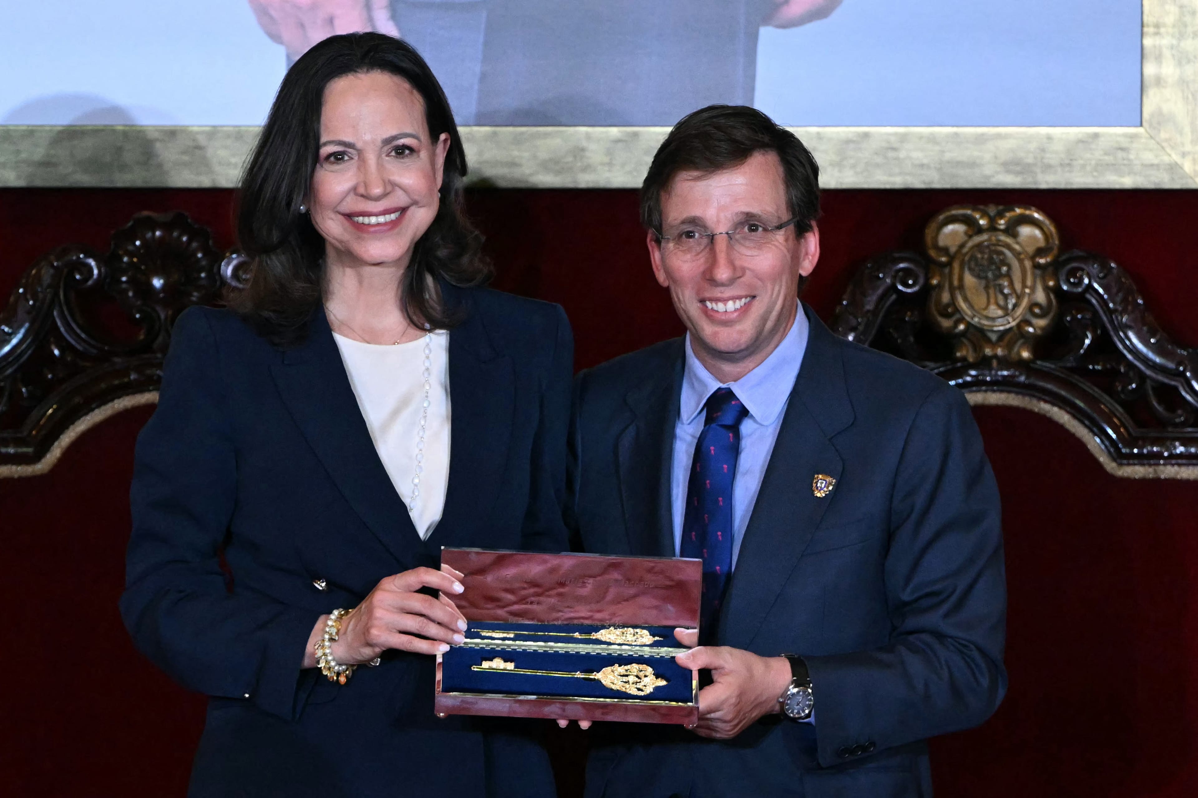 Venezuelan opposition leader Maria Corina Machado poses with Madrid Mayor Jose Luis Martinez-Almeida after receiving the Golden Key to the City, in Madrid, on April 17, 2026. (AFP)