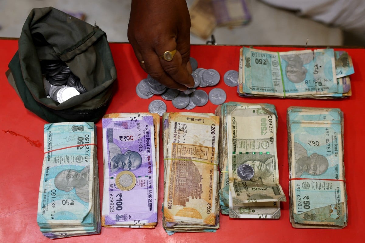 India scrambles to steady rupee as oil shock bites