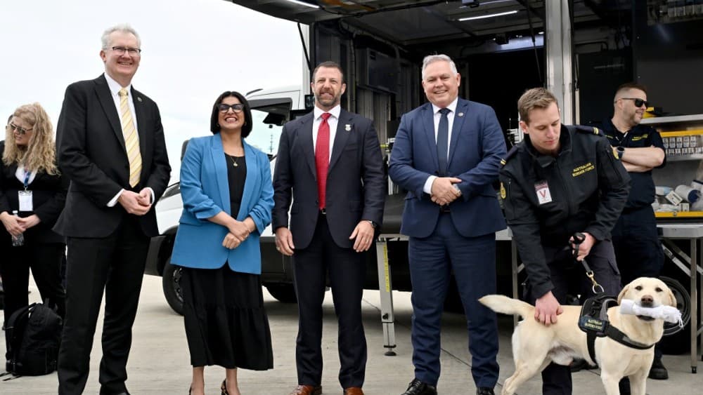 Australian Minister for Home Affairs Tony Burke (L), UK Home Secretary Shabana Mahmood (2nd L), US Secretary of Homeland Security Markwayne Mullin (C) and New Zealand Police Minister Mark Mitchell (2nd R) pose for a photograph as they watch a sniffer dog