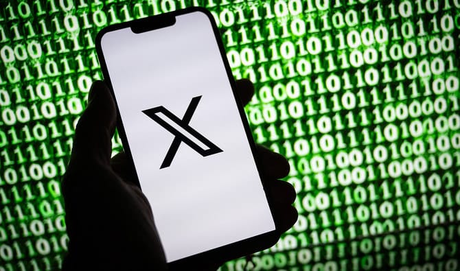 This illustration photograph taken on October 30, 2023, shows the X (former Twitter) logo on a smartphone in Mulhouse, eastern France. (AFP/File)