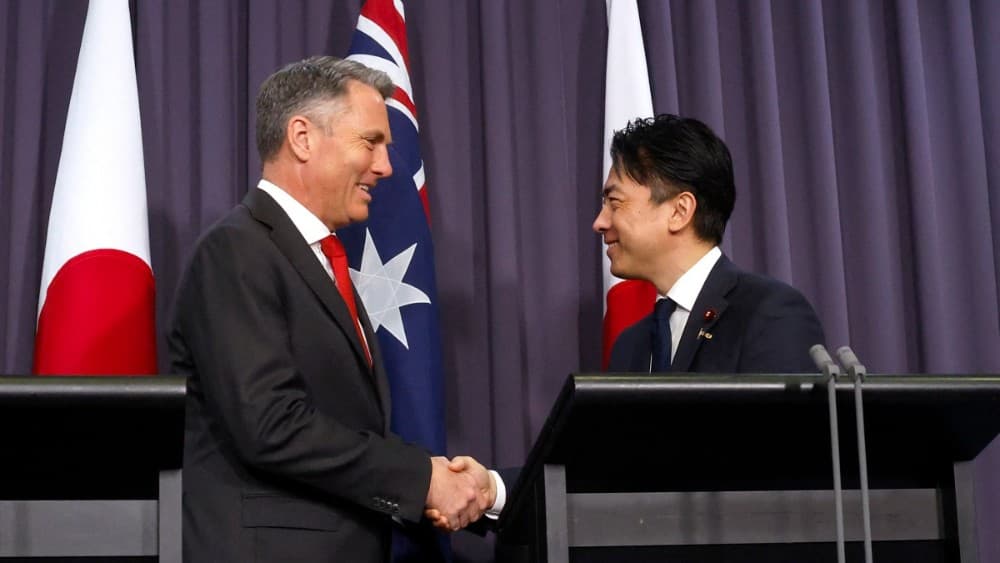 Australian Deputy Prime Minister and Defence Minister Richard Marles (L) shakes hands with Japan’s Defence Minister Shinjiro Koizumi (R) during a press conference at Parliament House in Canberra on August 18, 2026. (Photo: AFP)
