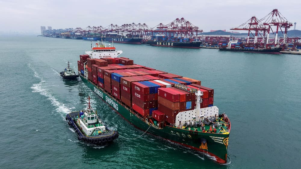 A container ship arrives at the port in Qingdao, in east China’s Shandong province on September 21, 2026. (AFP)