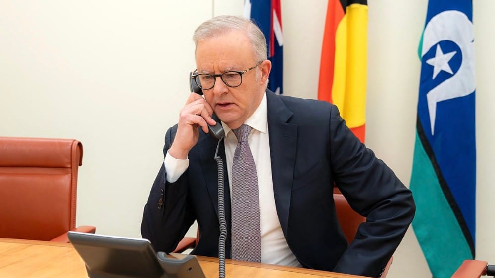 This handout image, released by the Australian Prime Minister’s Office on August 14, 2026, shows Australian Prime Minister Anthony Albanese speaking by phone with US President Donald Trump, during which Albanese asked for an exemption from tariffs imposed