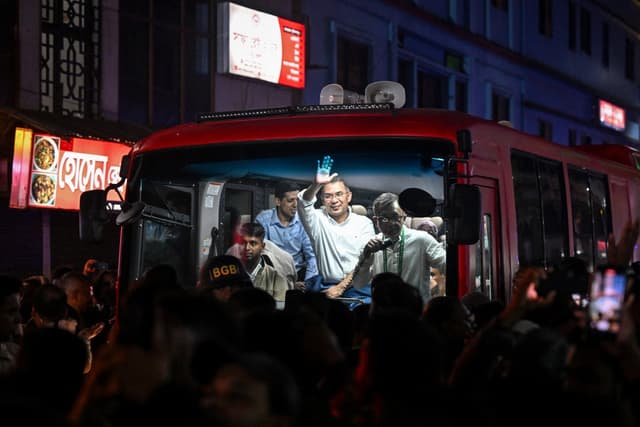 TOPSHOT - Bangladesh Nationalist Party (BNP) chairman Tarique Rahman waves to supporters from a vehicle after visiting the shrine of Sufi saint Hazrat Shahjalal in Sylhet on January 21, 2026, as part of the official launch of his election campaign. (AFP)