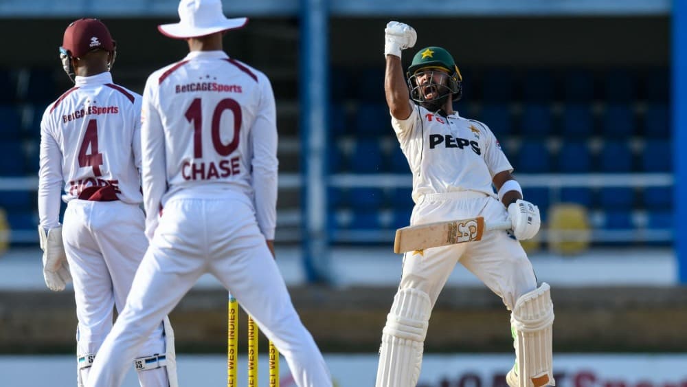 Abdullah Shafique of Pakistan (R) celebrates his century during the second day of the second Test match between West Indies and Pakistan at Queen's Park Oval in Port of Spain, Trinidad and Tobago, on August 3, 2026. (Photo: AFP)