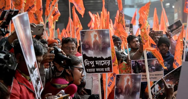 Bharatiya Janata Party (BJP) and religious activists protest near the Deputy High Commission of Bangladesh office in Kolkata on December 22, 2025 (AFP)