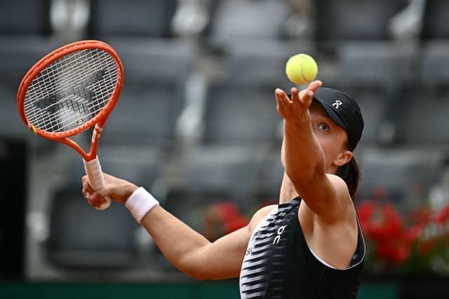 Poland's Iga Swiatek serves to US Caty McNally during their women's singles match of the WTA Rome Open tennis tournament at the Foro Italico in Rome on May 8, 2026. (AFP)