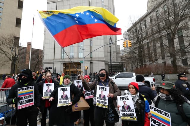 Demonstrators hold signs in support of ousted Venezuelan president Nicolas Maduro outside the Daniel Patrick Moynihan United States Courthouse as Maduro awaits his arraignment hearing on January 5, 2026 in New York. (AFP)