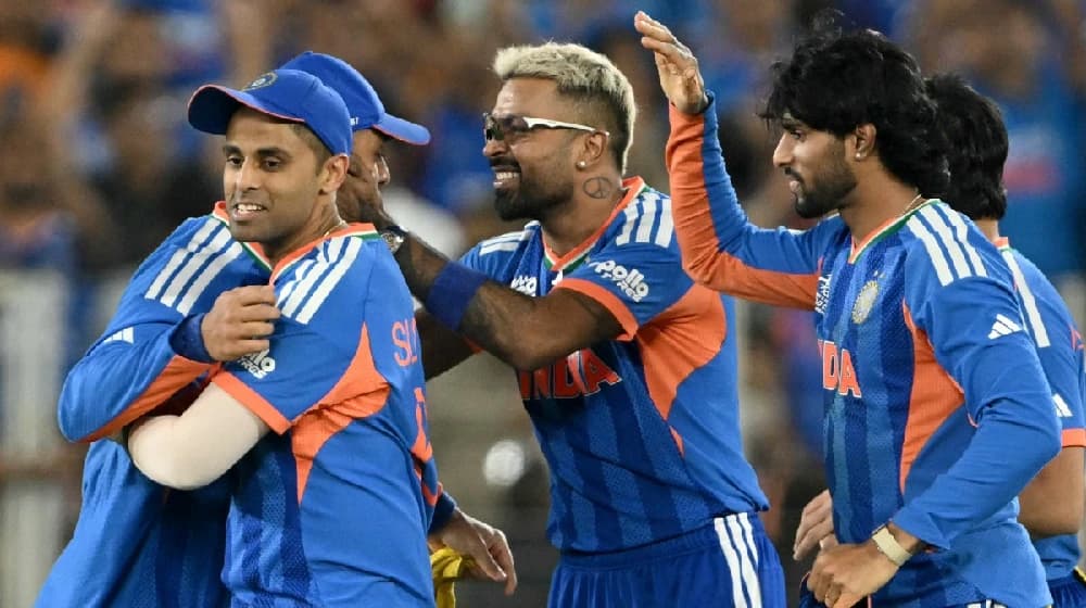 India's players celebrate after winning the 2026 ICC Men's T20 Cricket World Cup final match between India and New Zealand at the Narendra Modi Stadium in Ahmedabad on March 8, 2026. (Photo by Dibyangshu SARKAR / AFP)