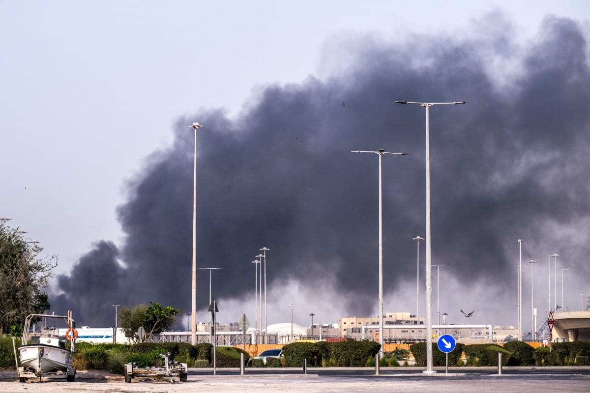 A plume of smoke rises from the Zayed Port following a reported Iranian strike in Abu Dhabi on March 1, 2026. (AFP)